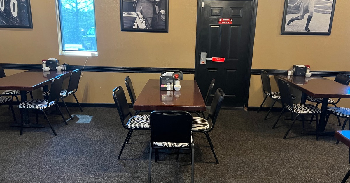 Tables and chairs by the wall