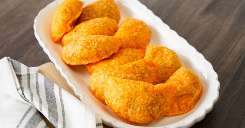 A plate with Fried potato and beef patties