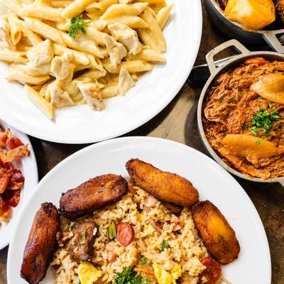Assorted dishes including pasta alfredo, Cuban style fried rice, and beef stew.