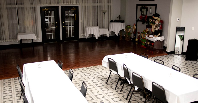 Interior, dining area, tables with white tablecloths and chairs