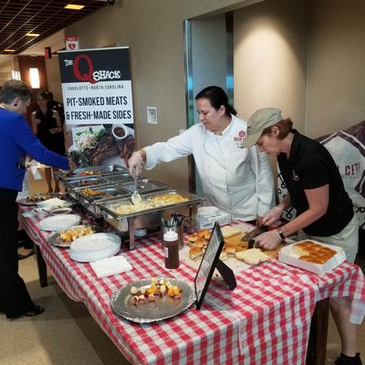 People serving food.