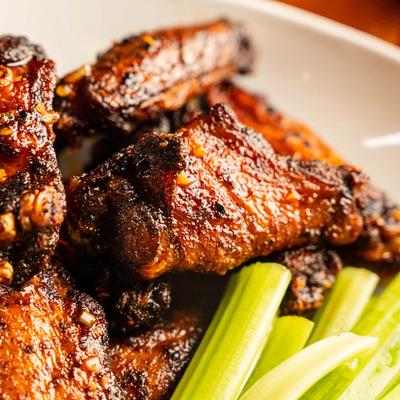 Grilled chicken wings with celery