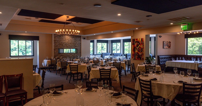 Interior, tables set for guests,  dining area