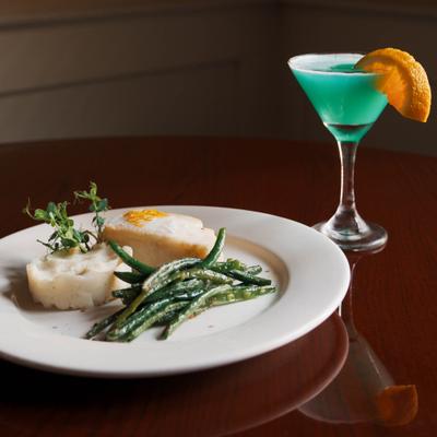 Chilean sea bass, with mashed potatoes, green beans, and a Turquoise Daiquiri.