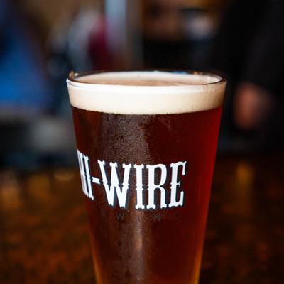 A pint of beer with a frothy head.