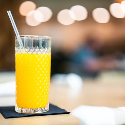 A glass of orange juice.