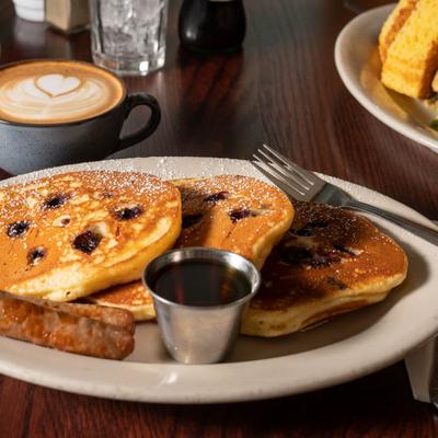 Buttermilk Pancakes accompanied with a cup of latte.