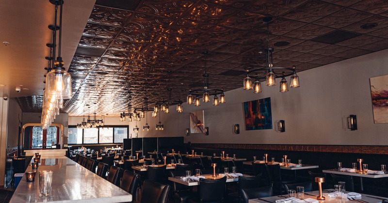 Interior, wide view of dining area, pictures on the wall