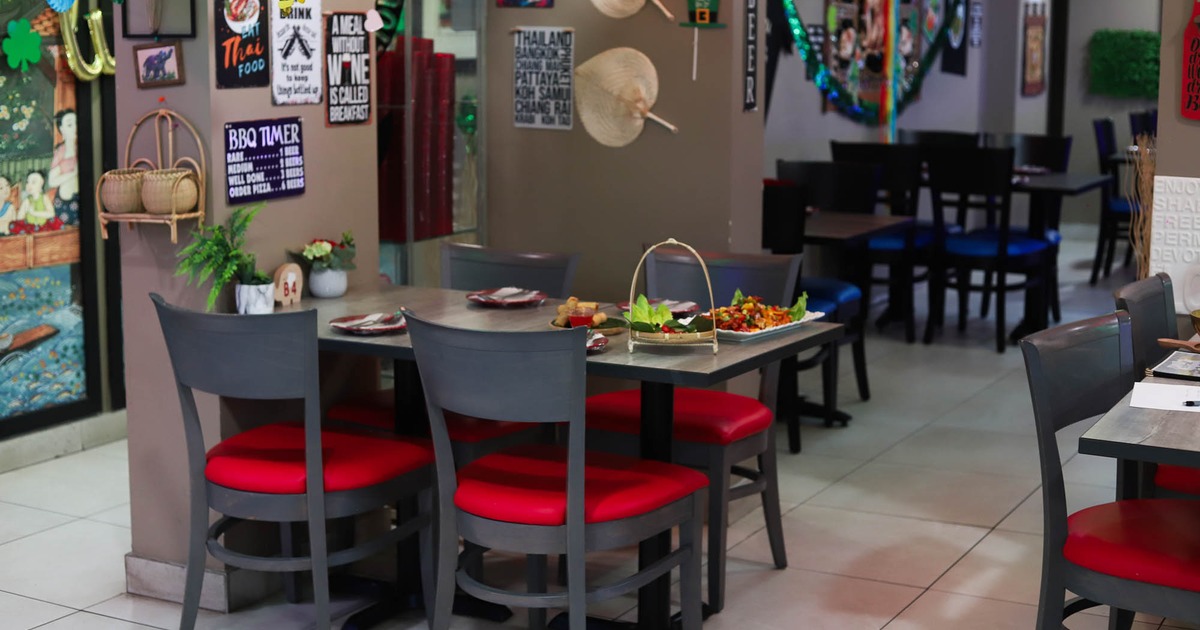 Dining area, table with served dishes and tableware