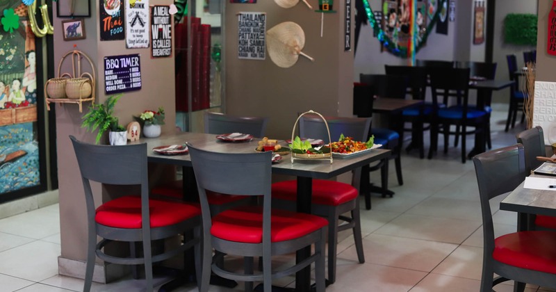 Dining area, table with served dishes and tableware