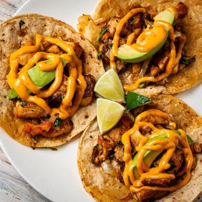 Fish tacos, served, top view.