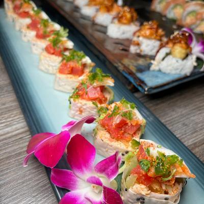 Rolls with spicy crab, shrimp tempura, spicy tuna, cilantro, avocado, and spicy sauce.