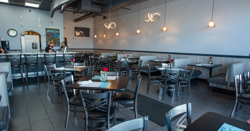 Interior, wide view of seating area, tables and chairs