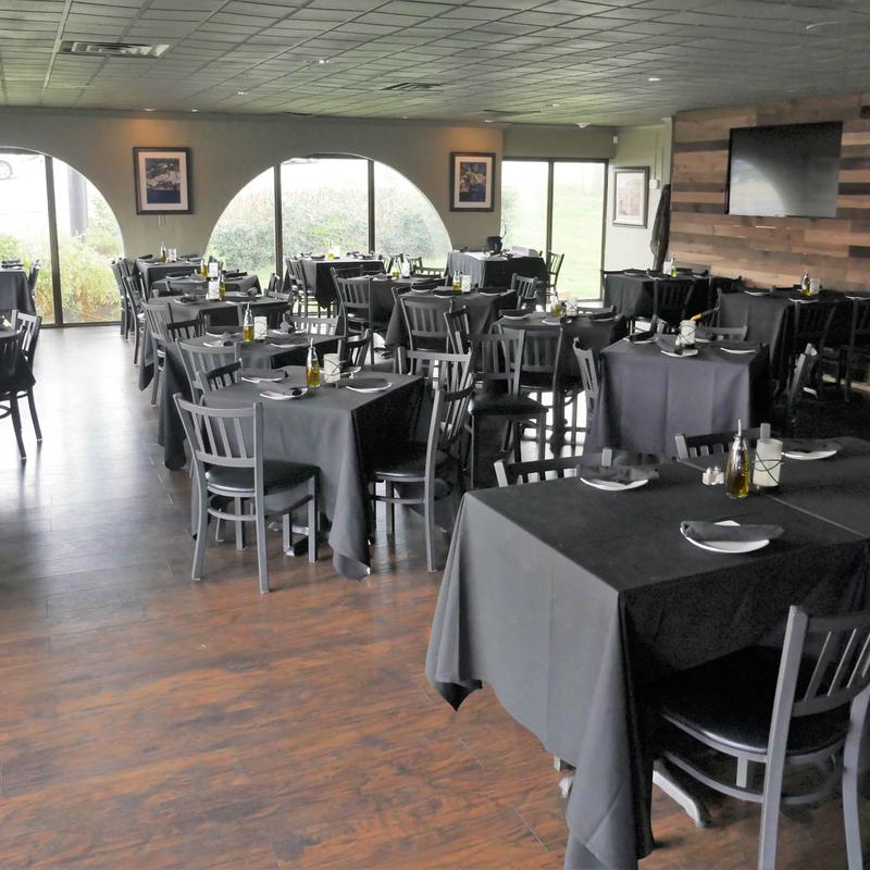 Interior, tables and chairs ready for guests
