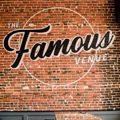 The restaurant's name on a bare brick wall.