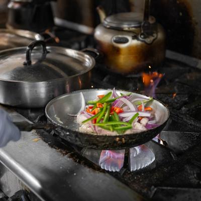 Veggies in a frying pan.