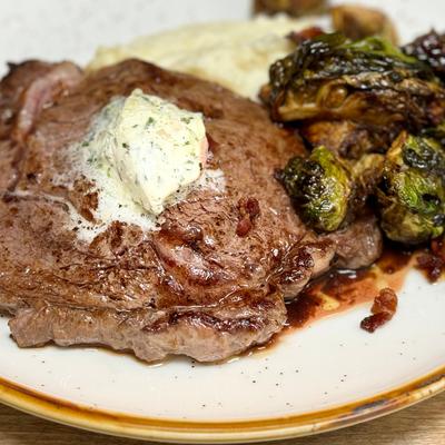 Brandt Beef Ribeye, mashed potatoes, fried Brussels sprouts, compound butter.