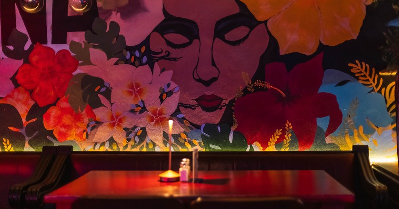 Interior, table with mural on the wall