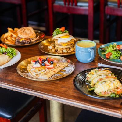 Assortment of dishes served on the table with a cup of coffee.