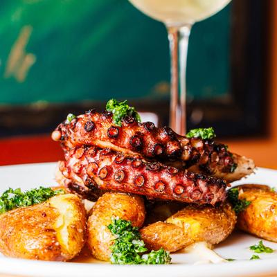 Braised octopus with crispy salt and vinegar potatoes.