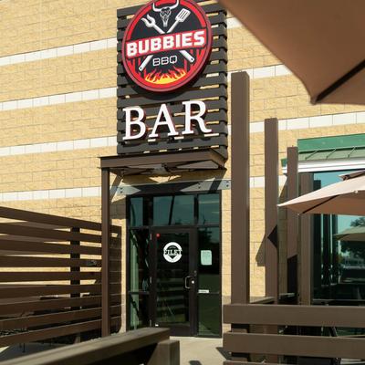 Exterior, entrance with Bubbie's BBQ sign above the door.
