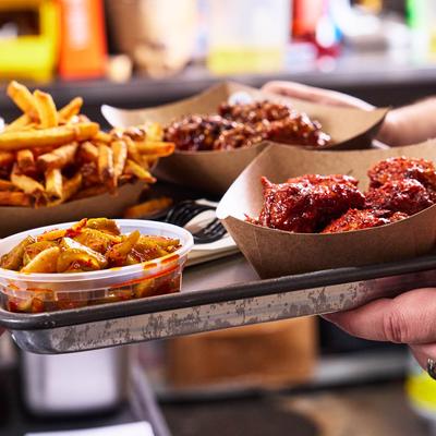 A tray of food from Dak Dak Korean Wings,.