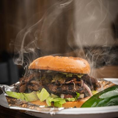 Steaming asada burger.