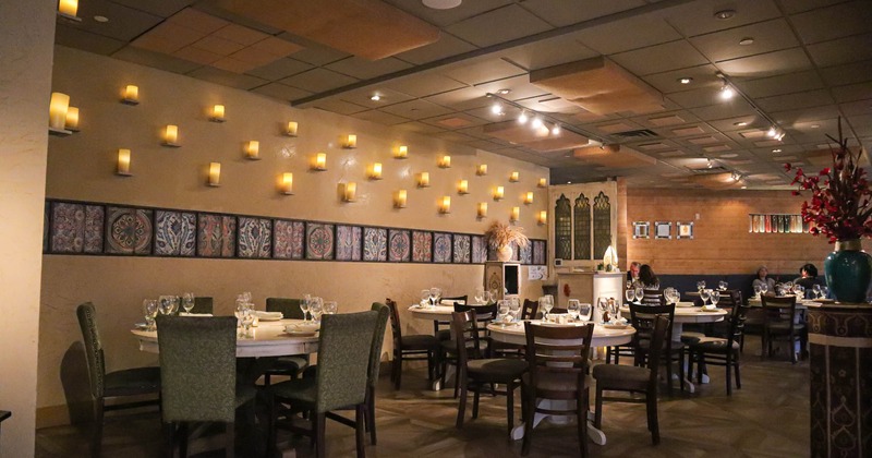 Interior, dining area, set tables ready for guests, wall decorations