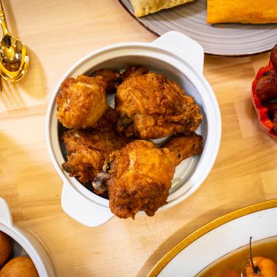 Fried chicken pot with other dishes, top view