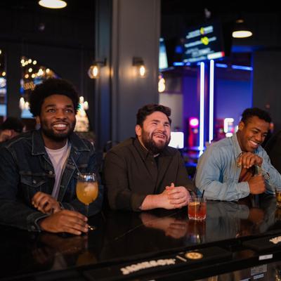 Guys sitting at the bar.