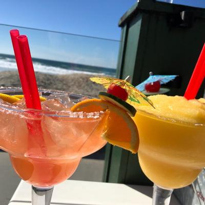 Two glasses of cocktails with decoration served