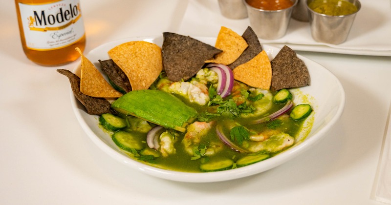 Aguachile served with tortilla chips on the side