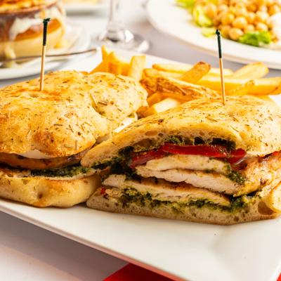 Grilled chicken sandwich with mozzarella and pesto on ciabatta bread