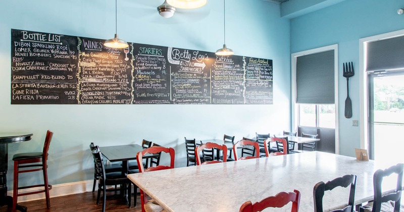 Interior, dining tables, menu chalkboard on the wall
