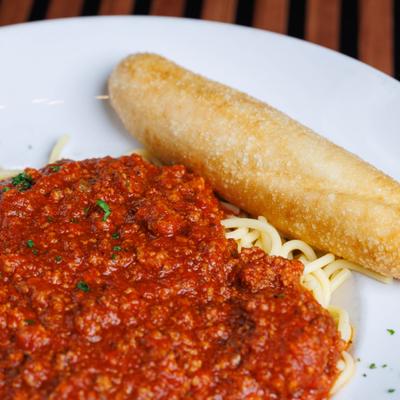 Spaghetti with red sauce and bread.