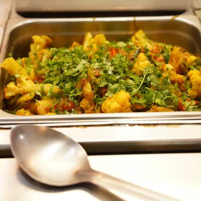 Aloo Gobi in a buffet tray.