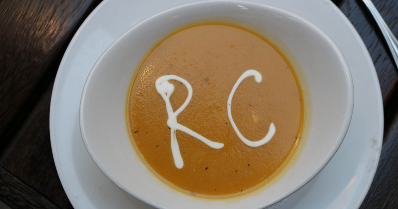 Soup decorated with restaurant's logo