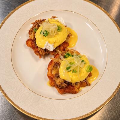 Lechon benedict: poached eggs, buttermilk waffle, salsa criolla.