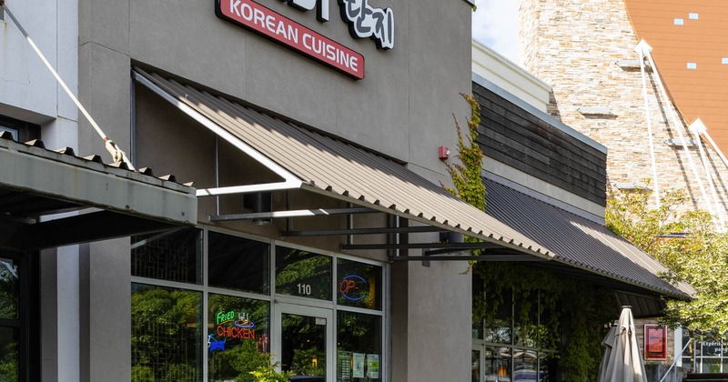 Exterior, storefront with entrance, awning and signage