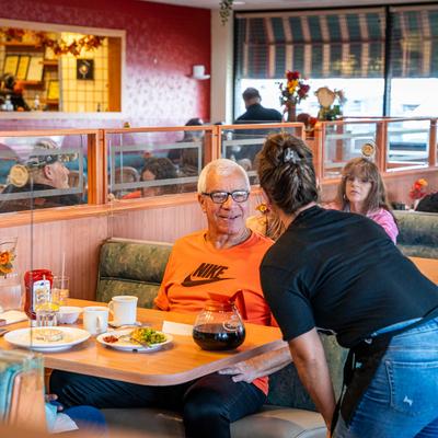 Employee serving a customer.