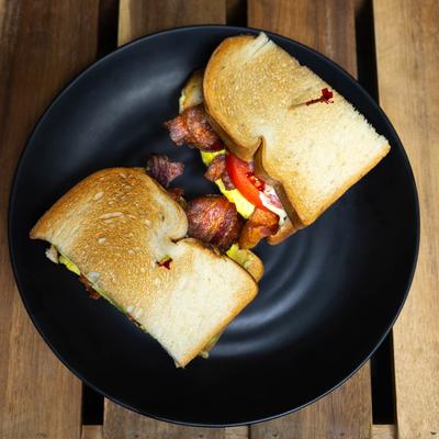 Scrambled egg Bacon Avo Tomato Sandwich.