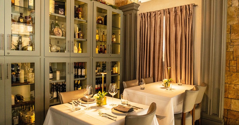 Interior, dining tables with glasses and accessories