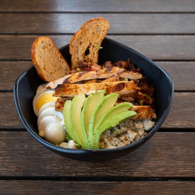 Chicken Cobb salad with avocado and toast.