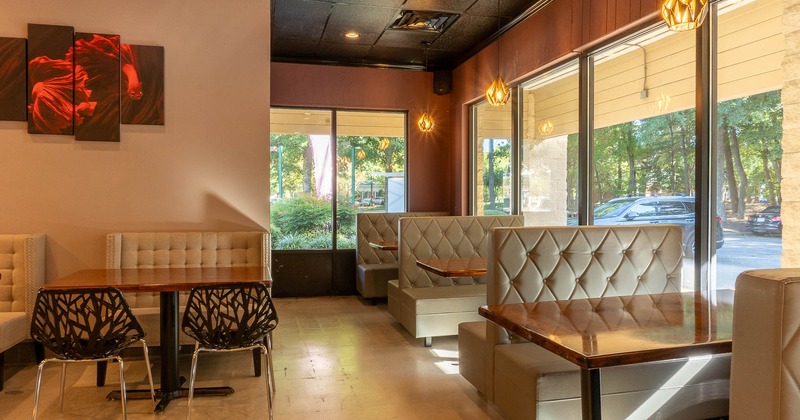 Interior, tables, chairs and booths by the window