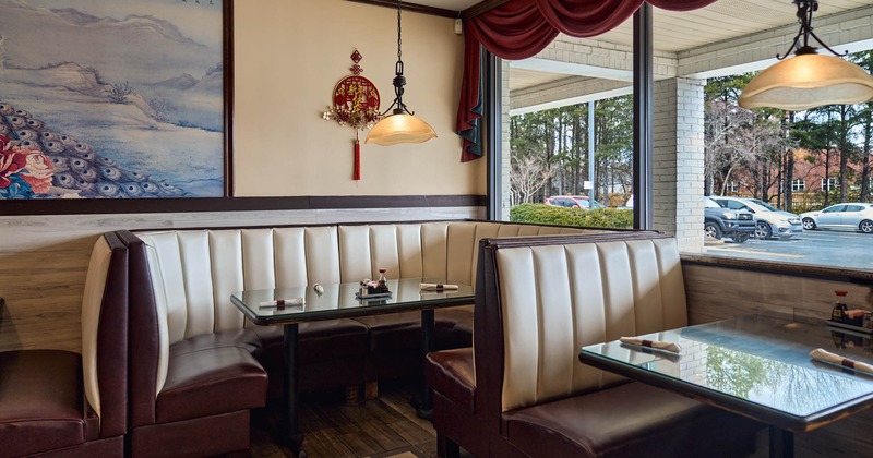 Interior, dining area, corner ''U'' shaped seating booth with table, windows with curtains