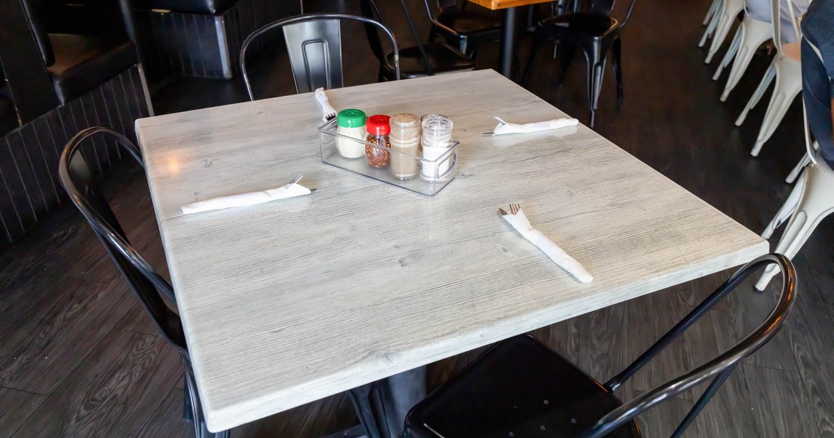 Interior, table set for guests in dining area