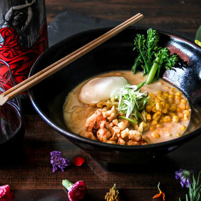 Ramen with eggs, corn, greens and seafood