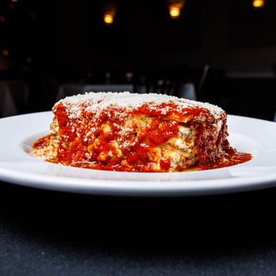 Lasagna, served on a plate.