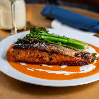 Salmon Filet with tomato sauce and broccolini.