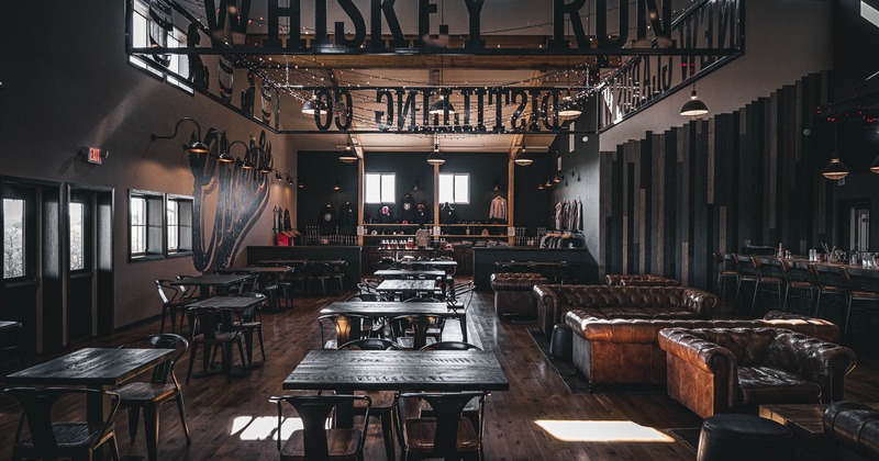 Interior, open space seating area, dining area on the left, lounge area on the right